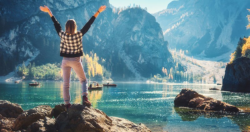 person standing in front of mountains 