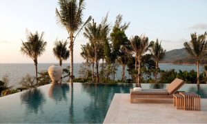 Small round backyard pool with patio seating