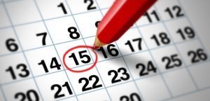 Red pen circling a date on a calendar.